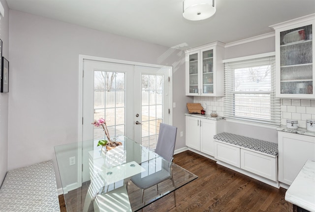 dining area featuring baseboards, dark wood finished floors, and french doors