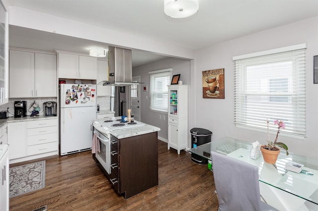 kitchen featuring white appliances, white cabinetry, island range hood, and dark wood-type flooring