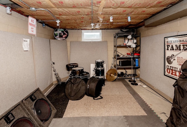 workout room featuring concrete block wall