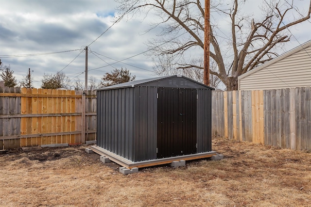 view of shed with a fenced backyard