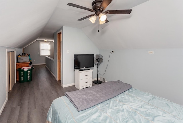 bedroom with lofted ceiling, ceiling fan, wood finished floors, and baseboards