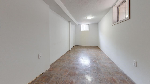 below grade area featuring a textured ceiling