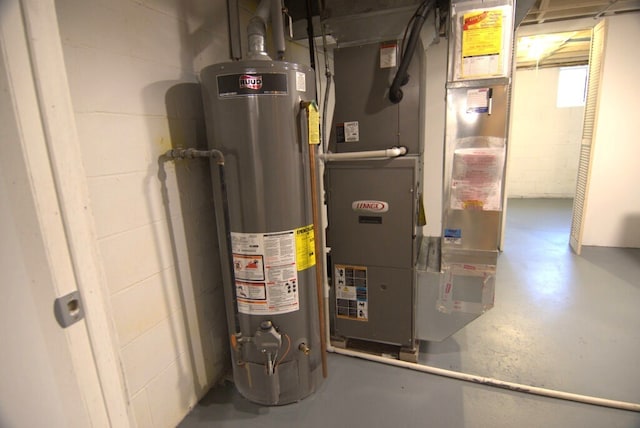 utility room with gas water heater and heating unit