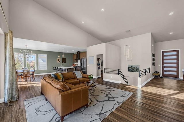 living area with dark wood-style floors, baseboards, high vaulted ceiling, and recessed lighting