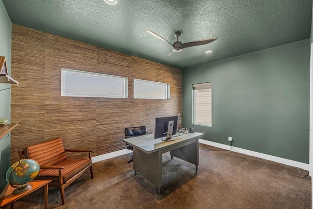 home office featuring baseboards, a ceiling fan, a textured ceiling, dark carpet, and recessed lighting