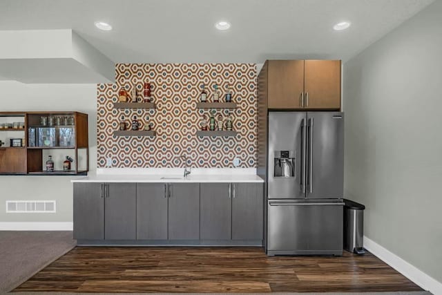 kitchen with recessed lighting, visible vents, baseboards, light countertops, and stainless steel refrigerator with ice dispenser