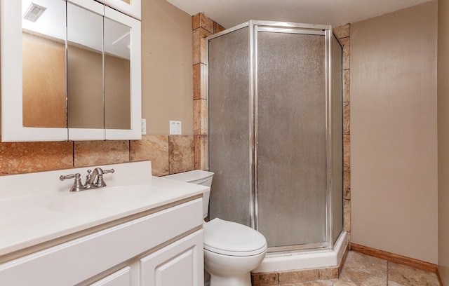 bathroom featuring visible vents, toilet, vanity, a shower stall, and backsplash