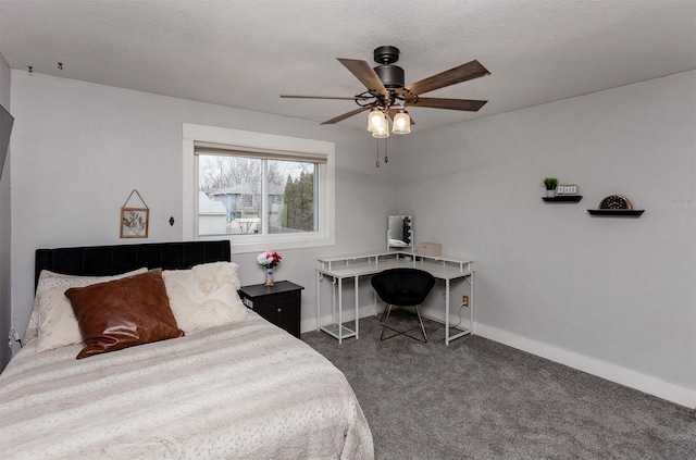 bedroom featuring carpet floors, ceiling fan, baseboards, and a textured ceiling