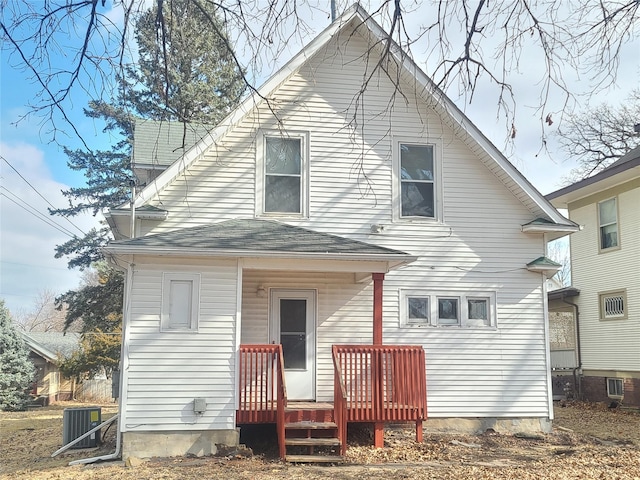 rear view of property featuring cooling unit