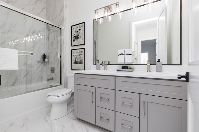 full bathroom featuring toilet, a sink, marble finish floor, combined bath / shower with glass door, and double vanity