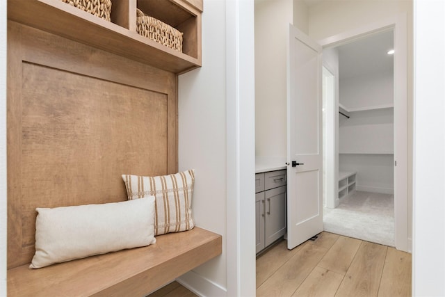 mudroom with light wood-style floors