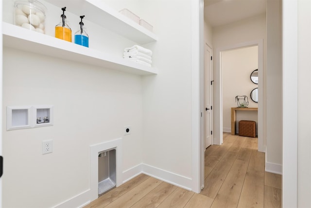 washroom with baseboards, washer hookup, light wood-type flooring, and hookup for an electric dryer