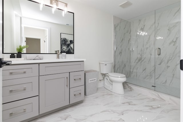 bathroom with toilet, marble finish floor, a marble finish shower, and vanity