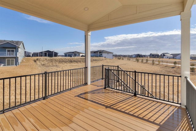 wooden terrace featuring a residential view