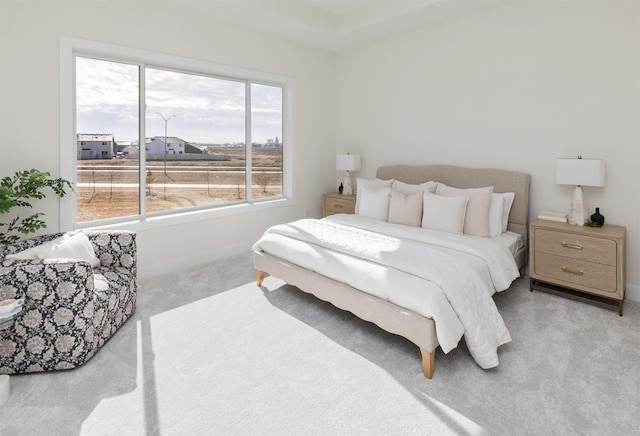 carpeted bedroom featuring baseboards