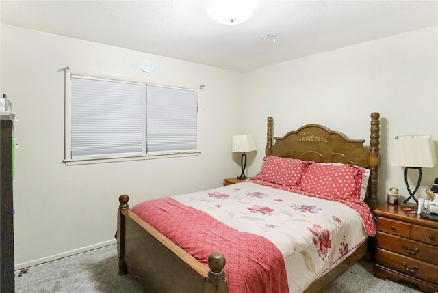 carpeted bedroom featuring baseboards