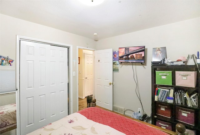 bedroom featuring visible vents