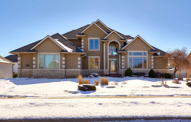 view of front of house with stone siding and stucco siding