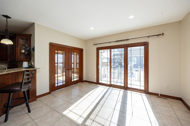 1205 NE 31st St, Ankeny, IA 50021 - doorway featuring french doors, plenty of natural light, light tile patterned flooring, and recessed lighting