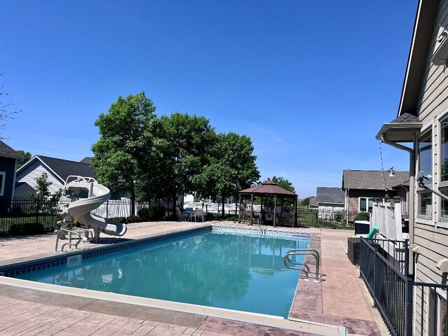 1205 NE 31st St, Ankeny, IA 50021 - view of swimming pool featuring a gazebo and a water slide