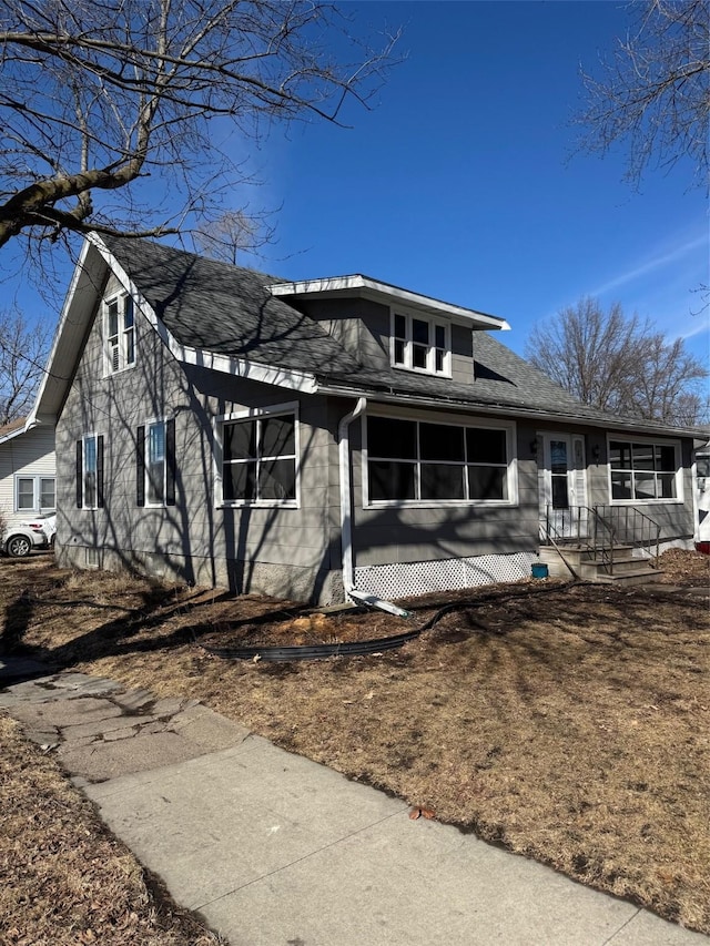 view of front of home featuring a shingled roof