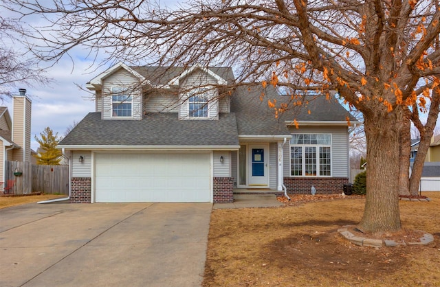 traditional home featuring concrete driveway, brick siding, roof with shingles, and fence