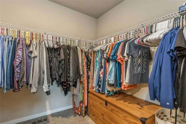 spacious closet with carpet floors and visible vents