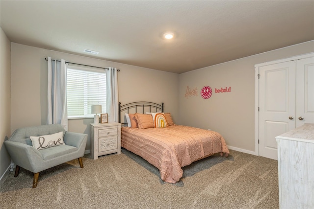 bedroom featuring carpet flooring, visible vents, and baseboards