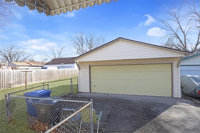 detached garage featuring fence