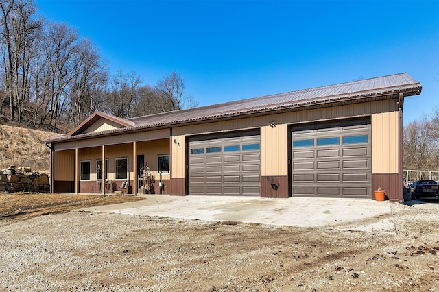 single story home featuring metal roof