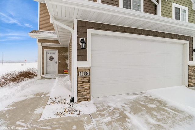 view of snow covered garage