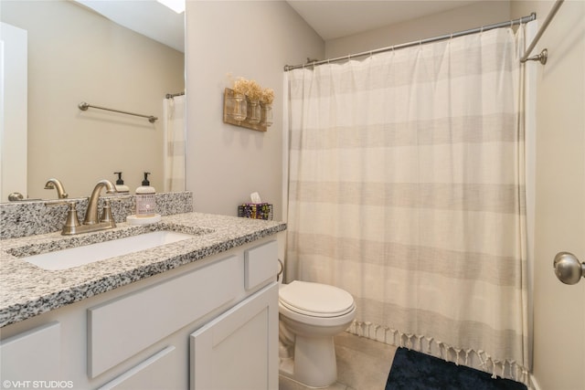 full bathroom featuring vanity, toilet, and tile patterned floors