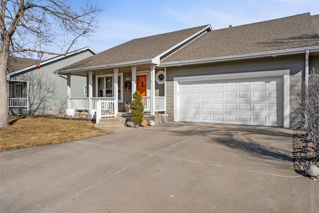 ranch-style home featuring an attached garage, covered porch, a shingled roof, and concrete driveway