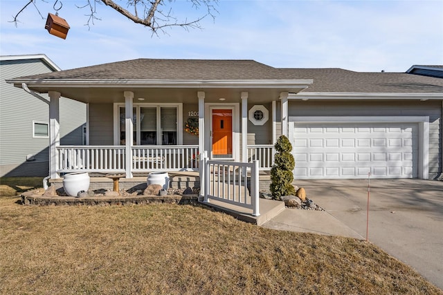 ranch-style house featuring a shingled roof, covered porch, concrete driveway, and a garage