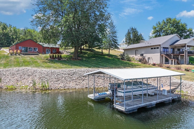 view of dock featuring a water view and a yard