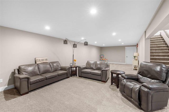 living room featuring recessed lighting, light carpet, baseboards, and stairs