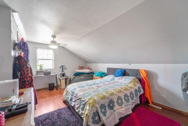 bedroom featuring vaulted ceiling, ceiling fan, and wood finished floors