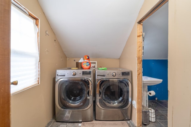 laundry area with laundry area and washer and clothes dryer