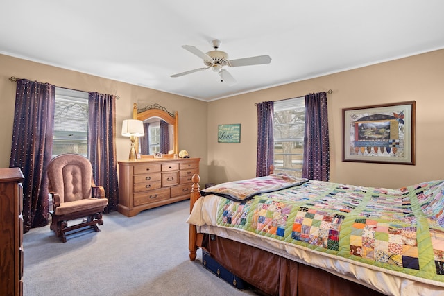 5808 Chamberlain Dr, Des Moines, IA 50312 - bedroom with light carpet, ornamental molding, and a ceiling fan