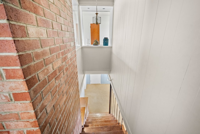 5808 Chamberlain Dr, Des Moines, IA 50312 - staircase with brick wall