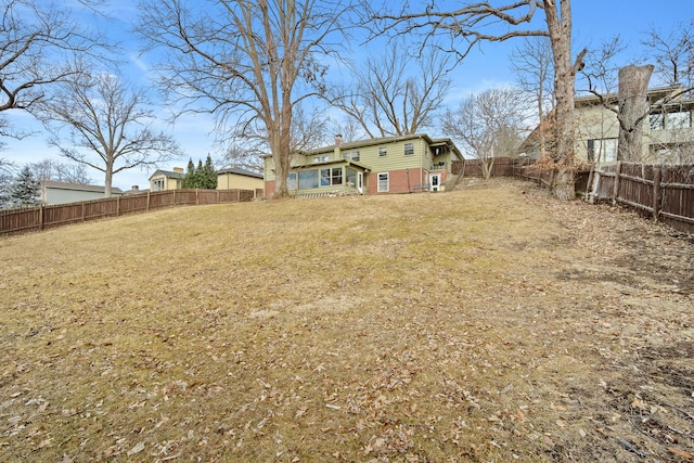 view of yard featuring a fenced backyard