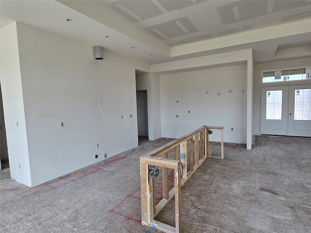 unfurnished room featuring french doors