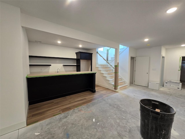 4732 162nd St, Urbandale, IA 50323 - indoor wet bar with stairs, recessed lighting, and light wood-style flooring