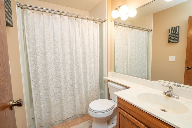 full bathroom with shower / tub combo, vanity, and toilet