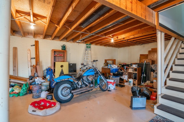 basement featuring stairs