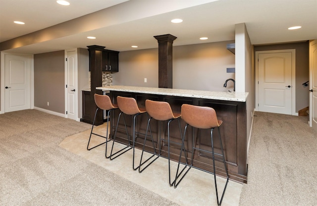 14201 Brookview Dr, Urbandale, IA 50323 - indoor wet bar with light colored carpet, recessed lighting, and baseboards