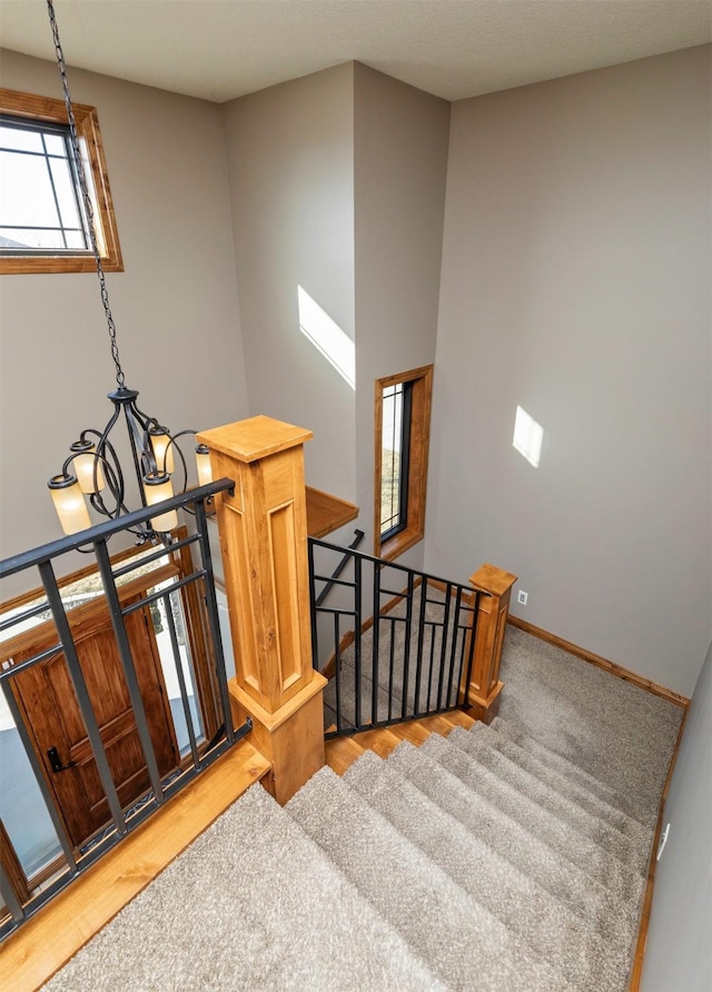 14201 Brookview Dr, Urbandale, IA 50323 - staircase with baseboards and wood finished floors