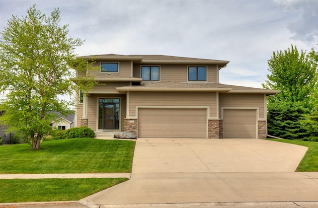 14201 Brookview Dr, Urbandale, IA 50323 - prairie-style house with a front lawn, driveway, stone siding, and an attached garage