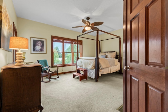1905 W Olive St, Marshalltown, IA 50158 - carpeted bedroom featuring a ceiling fan and baseboards