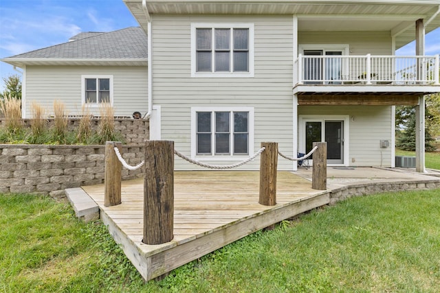 1905 W Olive St, Marshalltown, IA 50158 - rear view of property featuring a balcony, a yard, roof with shingles, and a deck